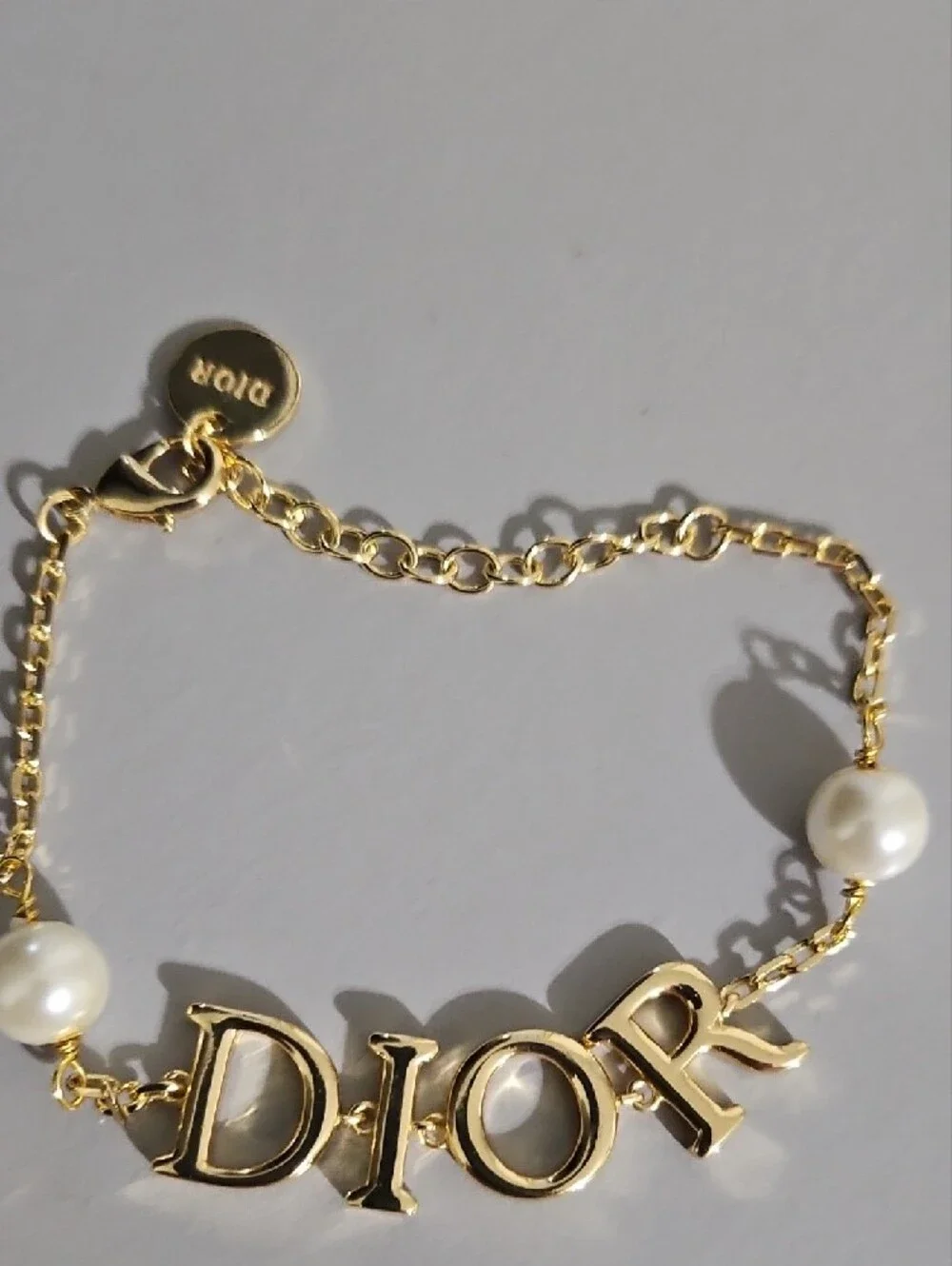 D Letter Gold Tone Logo Bracelet with Pearl Accents